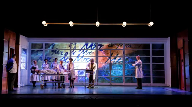 Medical staff gather around asOrlando is give electric shock therapy