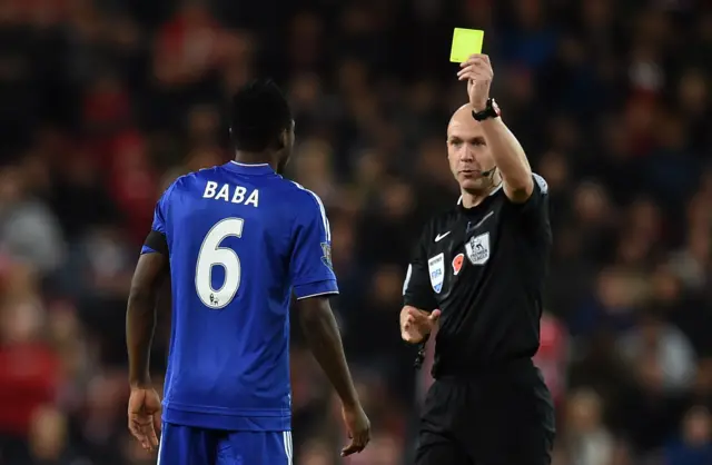 Defender Baba Rahman gets a yellow card