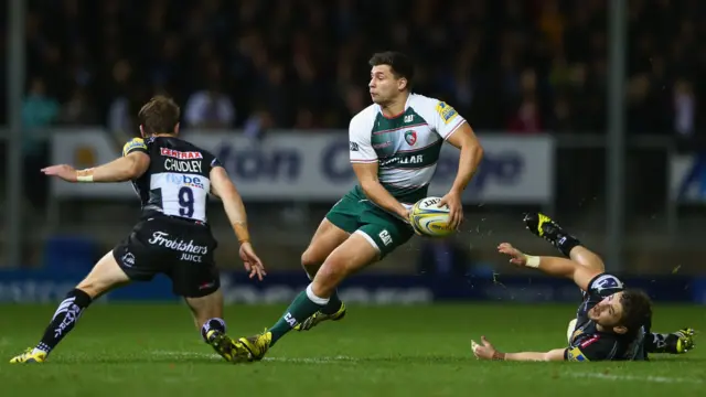 Ben Youngs (C) of Leicester Tigers looks to offload as Will Chudley (L) and Luke Cowan-Dickie (R) of Exeter Chiefs