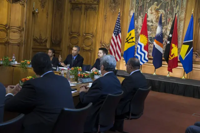 President Obama with flags and island state leaders