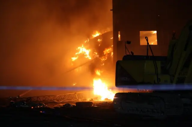 Firefighters jets on intense fire at recycling plant