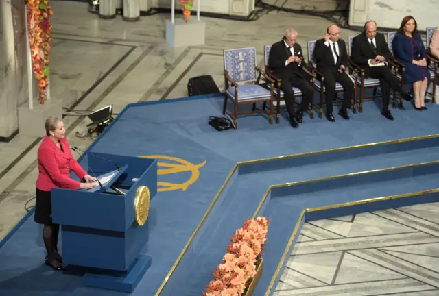 Chairperson of the Norwegian Nobel committee Kaci Kullmann-Five (L to R) speaks during the Peace Prize awarding ceremony at the City Hall in Oslo on 10 December 2015