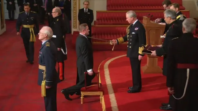 Gary Verity receiving knighthood from Prince Charles