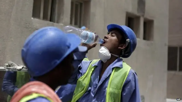 A migrant worker from Nepal takes a break on a building site in Doha, Qatar on 03 May, 2015