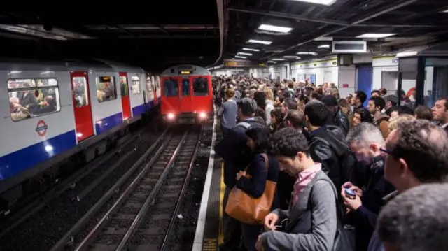 London commuters waiting for a Tube train