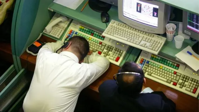 Tired worker leaning over keyboard