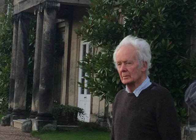 Godfrey Meynell outside his home