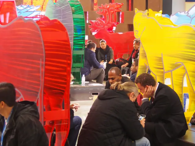 people sitting with plastic animals