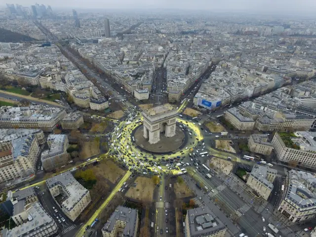 Arc de Triomphe from the air with yellow paint on the roads