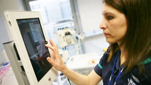 Nurse with tablet computer