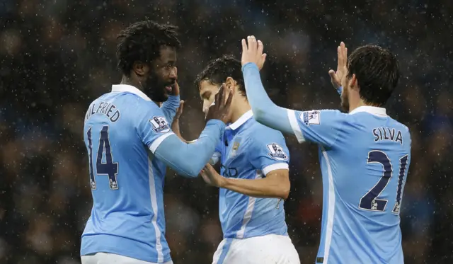 Manchester City players celebrate the opening goal