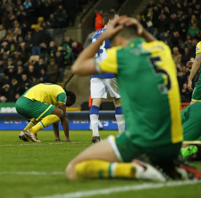 Norwich players react to Cameron Jerome's miss