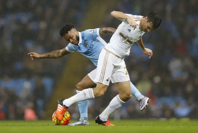 Jack Cork battles against Raheem Sterling