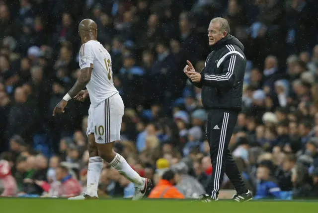 Alan Curtis speaks to Andre Ayew on the touchline