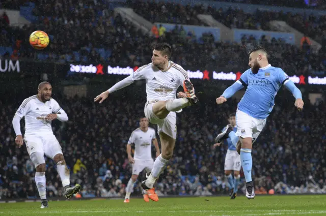 Nicolas Otamendi heads the ball