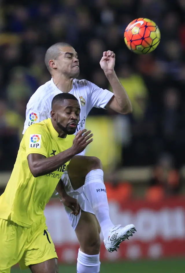 Pepe of Real Madrid battles for the ball