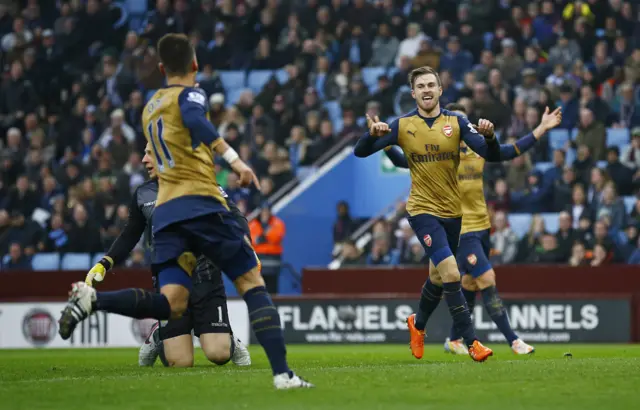 Aaron Ramsey celebrates with Mesut Ozil