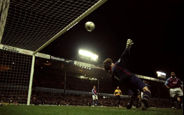 Dion Dublin scores against Arsenal in 1998