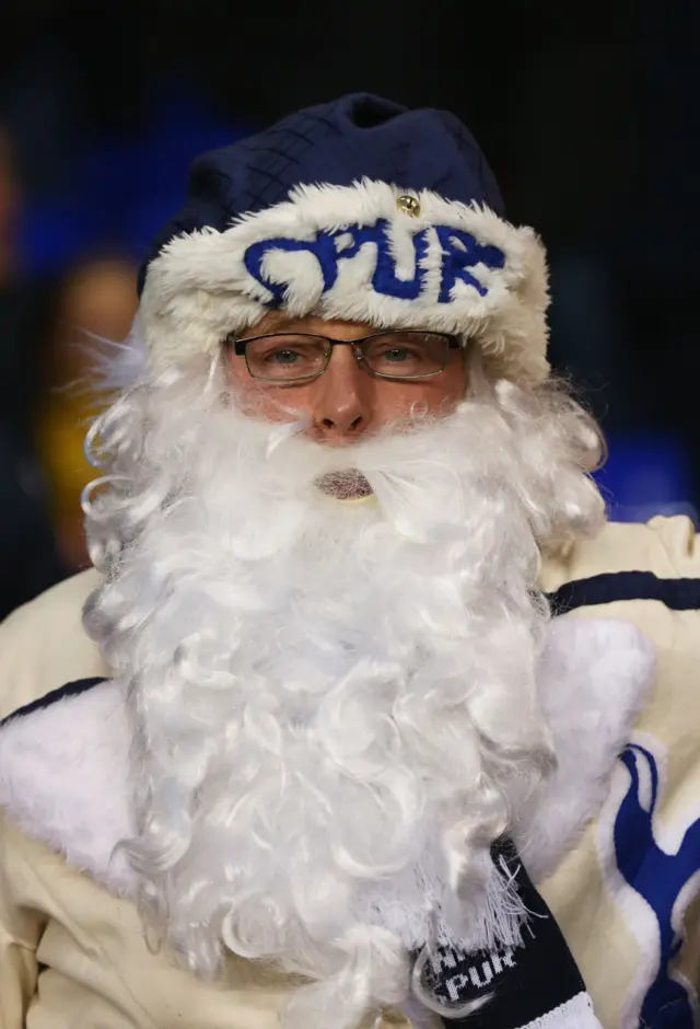 A Spurs fan dressed as Santa