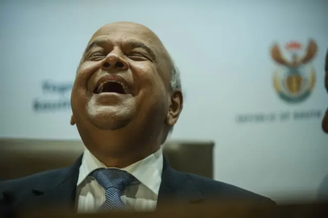 Newly Appointed South African Finance minister Pravin Gordhan laughs during a press conference, on December 14, 2015 in Pretoria