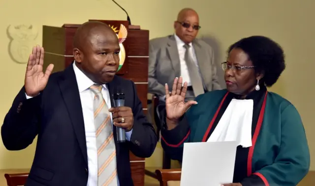 Justice Sisi Khampepe (R) swearing-in Mr David Douglas Des van Rooyen (L) as new South African Minister of Finance, while President Jacob Zuma (C) looks on at the Union Buildings in Pretoria, South Africa, 10 December 2015