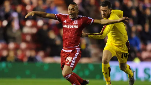 Emilio Nsue of Middlesbrough is pulled back by David Jones