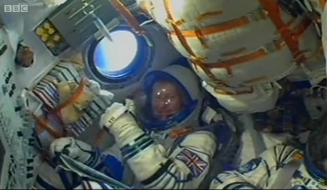 Tim Peake waves on board