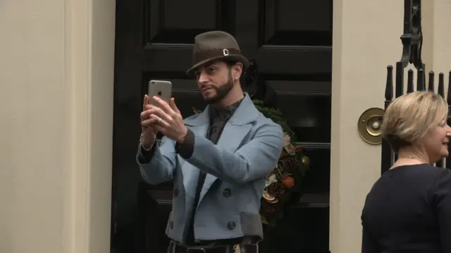 Celebrity choreographer, Brian Friedman poses for a selfie outside Number 11