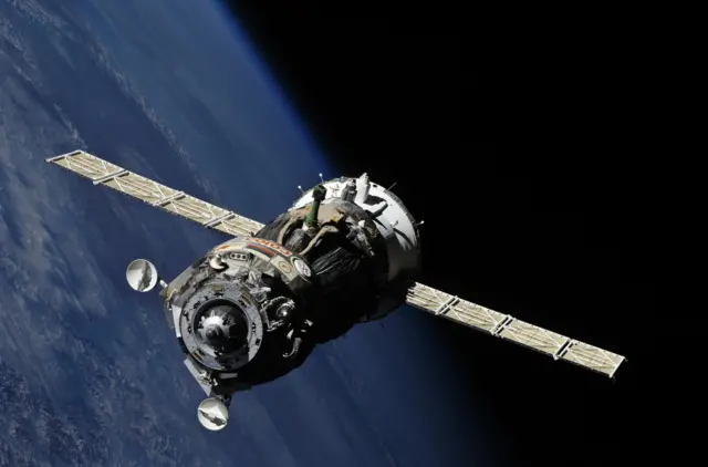 Soyuz craft over Earth