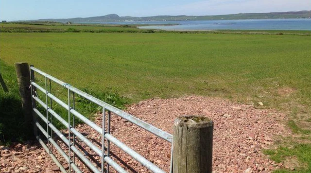 Scottish land behind a gate