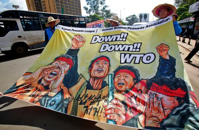 Anti-World Trade Organisation (WTO) demonstrators from various civil society groups around the globe protest in Nairobi on December 16, 2015