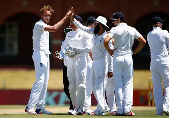 Stuart Broad is congratulated by Moeen Ali