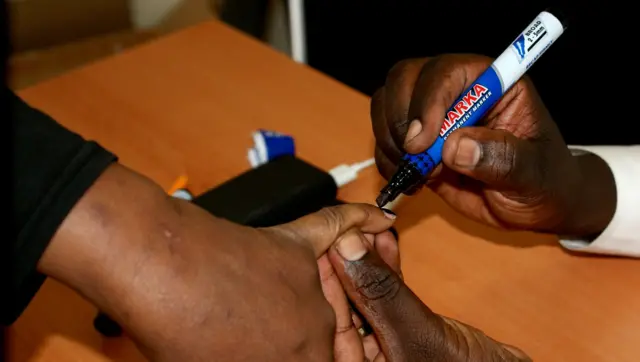 Rwandan voter in Kenya getting their finger marked