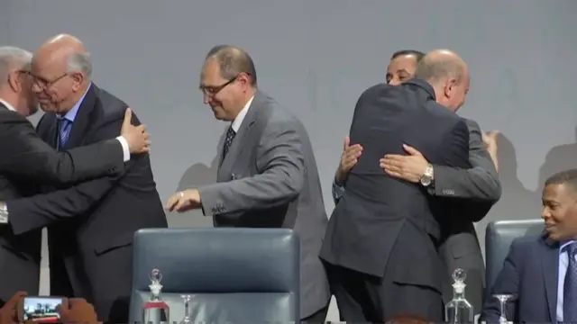 Delegates hugging