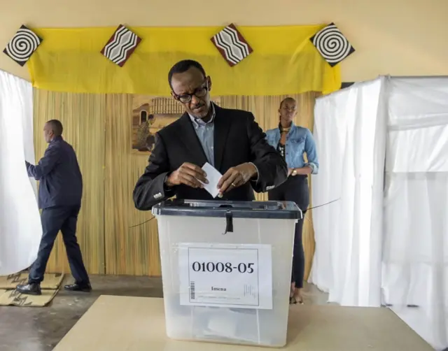 President of Rwanda, Paul Kagame posts his ballot, in Kigali, Friday, Dec. 18, 2015