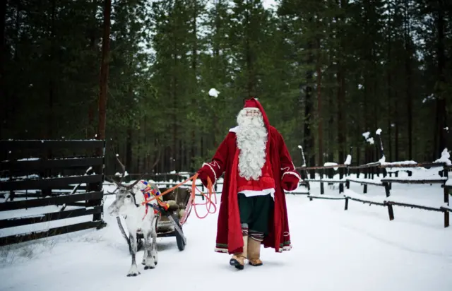 Father Christmas and a reindeer