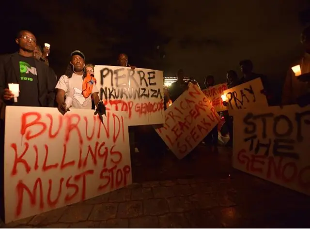 People holding placards for Burundi