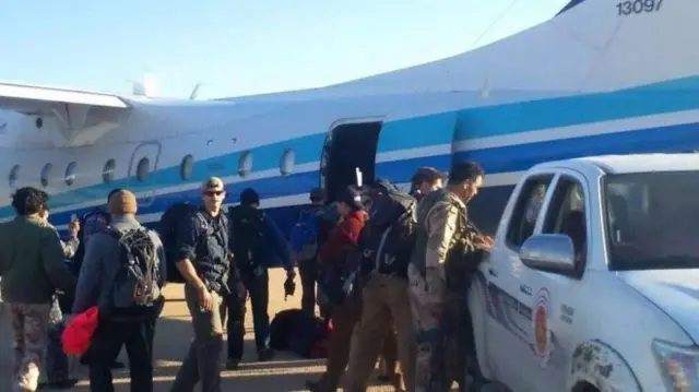 Photos posted on Facebook claim to show US troops getting back on their plane shortly after landing