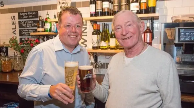 Gary Eddington with longest serving regular John Harris celebrating the re-opening of the Cat and Fiddle.