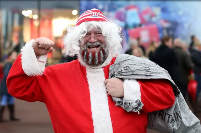 A Stoke City fan dresses as Santa for the Crystal Palace match