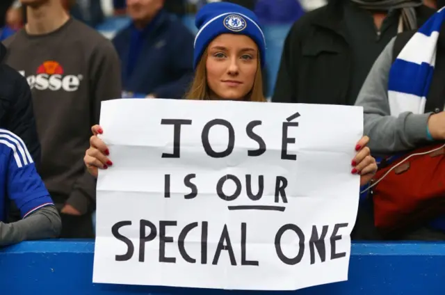 A Chelse a fan holding a banner which reads 'Jose is our special one'