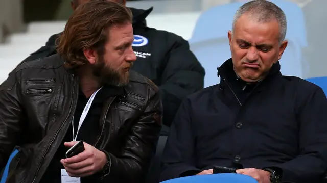 Jose Mourinho grimaces while sat in the stands for Brighton v Middlesbrough