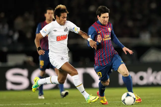 Neymar chases Lionel Messi