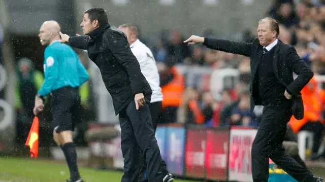 Steve McClaren and Remi Garde gesture