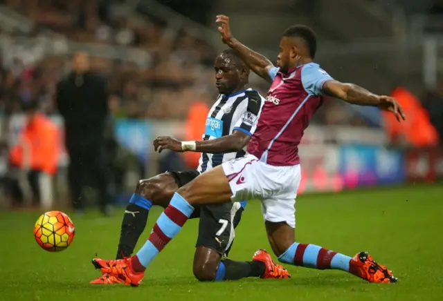 Moussa Sissoko of Newcastle United and Leandro Bacuna of Aston Villa compete for the ball