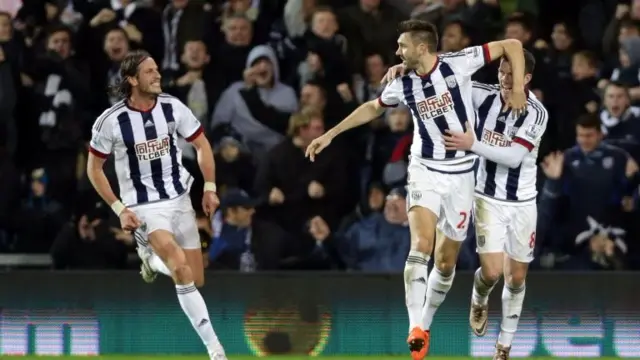 Gareth McAuley celebrates