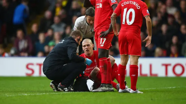 Martin Skrtel receives treatment for an injury