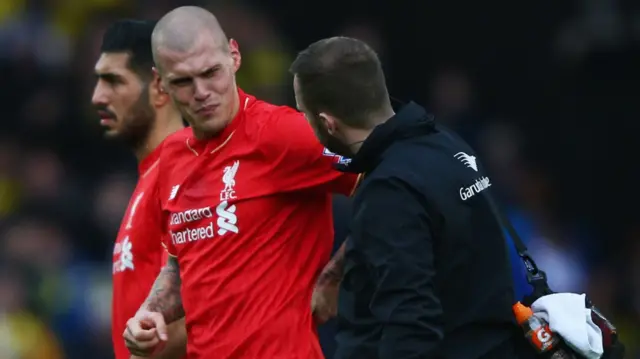 An injured Martin Skrtel is taken off for Liverpool