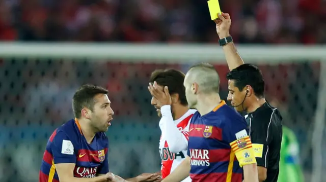 Jordi Alba is shown a yellow card