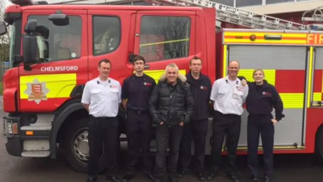 Paul Kelly (centre) with firefighters in Chelmsford today